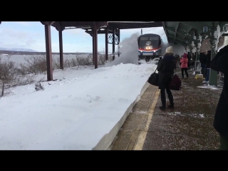 high speed train against snowdrifts