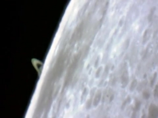 appearance of saturn from behind the moon